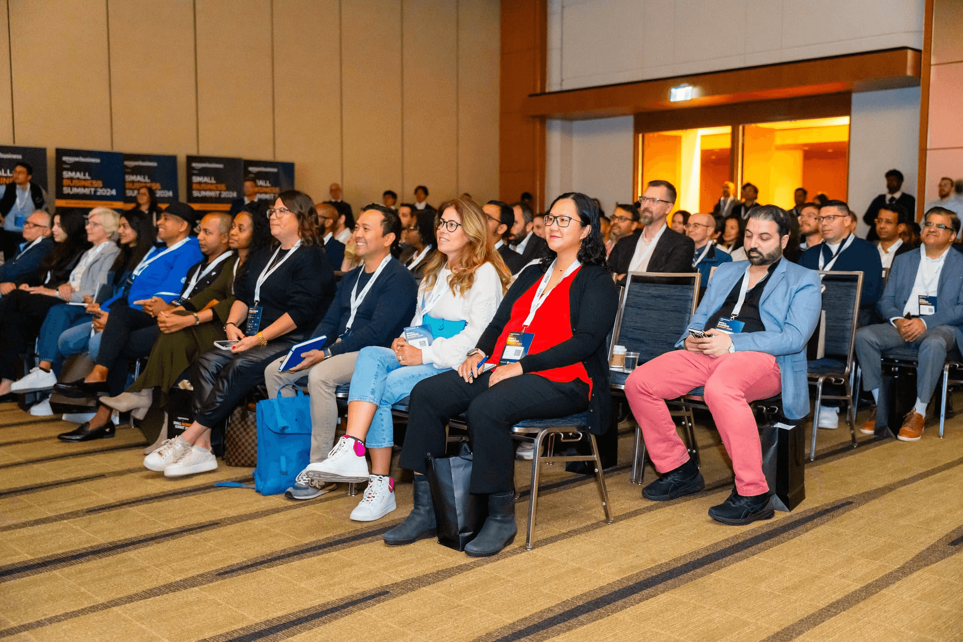 Attendees seated in the front rows of the Summit keynote hall